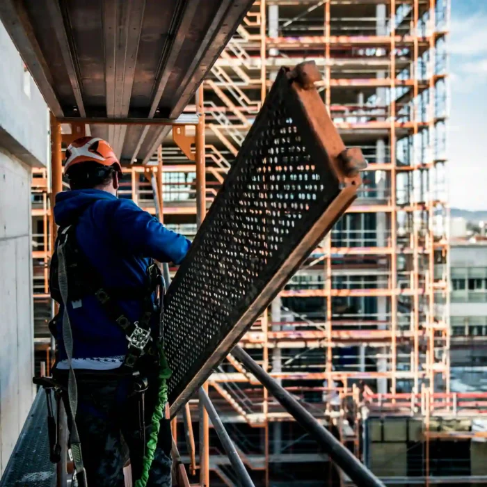 Worker using San Rafael Scaffolding Rental systems on a commercial construction site