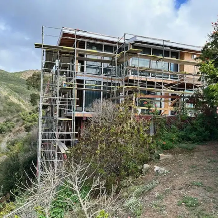Residential scaffolding surrounding a hillside home renovation project in San Rafael