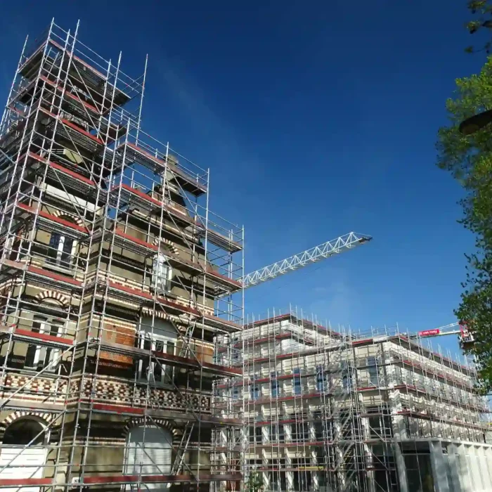 Multi-level San Rafael Scaffolding Rental system surrounding commercial buildings