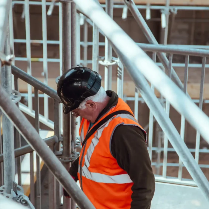 Technician inspecting San Rafael Scaffolding Rental structure with safety equipment